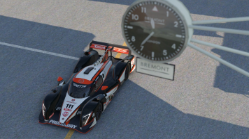 Ginetta G55 passing under the Donington pit clock.png