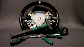 Fanatec Porsche GT3 Wheel surrounded by tools.png